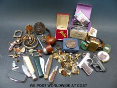 A collection of various collectable items to include lighters, penknives, pipes,