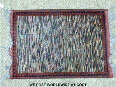 A small multicoloured rug (98 x 67cm)