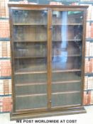 A glazed mahogany bookcase with six adjustable shelved (H180 x W126 x D25cm)