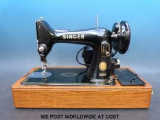 A Singer electric sewing machine in case