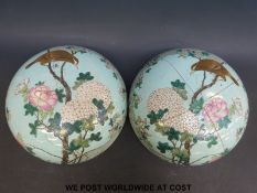 A pair of Chinese lids or covers decorated with birds and flowers on turquoise ground (24cm