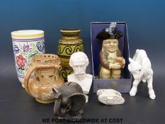 A Poole pottery vase, toby jug, parian bust of Napoleon III, puzzle jug,