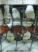 Two mahogany and cast iron pub tables (H70cm,