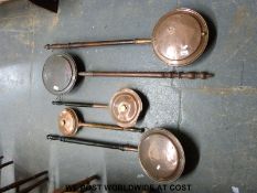 Five copper bed or warming pans
