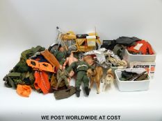 A collection of Action Man figures and accessories including motorbike, clothing, dogs, guns,