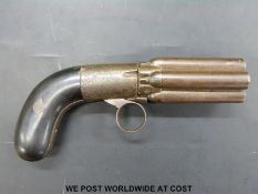 Gueury pepperbox percussion revolver with ornate engraved decoration and five 3 inch barrels,