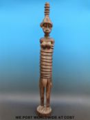 An African tribal female figure with elongated ribbed body (97cm tall)