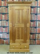 A pine wardrobe with drawer below (W94 x H196 x D60cm)