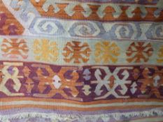 A 19thC rug with two hexagonal guls and orange borders