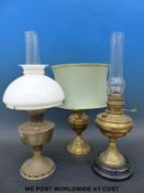 Three brass oil lamps,