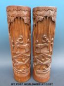 A pair of 19th/20thC carved bamboo brush pots decorated with figures (36cm tall)