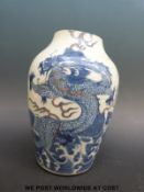 A Chinese blue and white vase (cut down) with iron red dragons and Daoguang mark to base (18cm