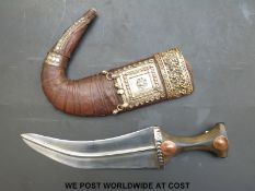 A Middle Eastern jambiya dagger with an inlaid horn handle,