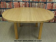 A contemporary light oak extending table (W120 x L164 x H76cm)