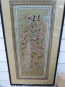 A Chinese silk embroidery depicting children and animals (73cm x 39cm)