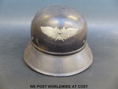 A WWII Nazi German Luftschutz helmet with H L factory insignia to side,