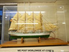 A model of a four masted sailing ship on stand (90cm long) in perspex case