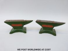 Two small Meccano anvils in green with red and gold plaques,