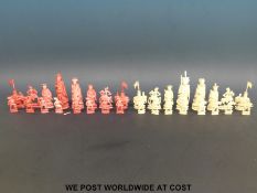 A late 19thC complete Chinese carved ivory chess set,