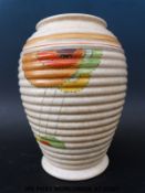 An Art Deco Pottery ribbed vase with sunburst design in the Clarice Cliff style marked D58/433 to