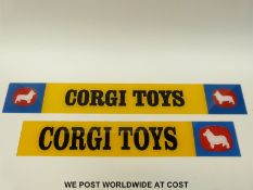 Two Corgi Toys plastic point of sale display signs (L76 xW10 and L64 x 10cm)