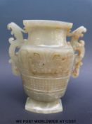 A Chinese archaistic mottled jade vase,