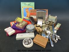 A box of collectables to include playing cards, novelty jumbo size lighter, horseshoe calendar,
