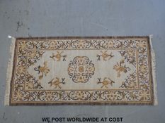 Two Tibetan hand made rugs (183 x 92cm)