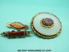 Three pinchbeck / yellow metal brooches,