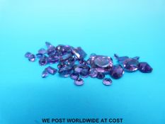 A packet of loose amethysts various cuts