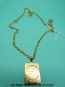 A 1/10 Krugerrand set in a 9ct gold pendant on a 9ct gold chain (18.