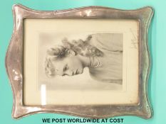 A large George VI hallmarked silver photo frame to suit a 8x6 inch photograph, Birmingham 1927,