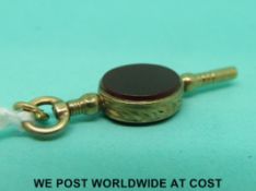 A 9ct gold watch key inset with bloodstone and agate