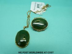 A jadite pendant and brooch from New Zealand