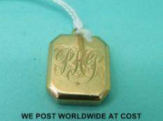 A Victorian yellow metal locket marked 18,