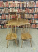 An Ercol light elm table (H73xL98xW90cm) and four chairs