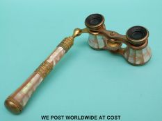 A pair of mother of pearl and gilt opera glasses.