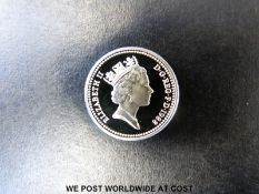 A 1988 silver proof cased one pound coin with certificate