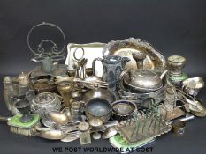 A quantity of silver plated items to include swing-handled trays, dressing table items,