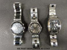 Two Swatch wristwatches together with a similar Casio.