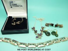 A silver bracelet, silver necklace set with amethysts,