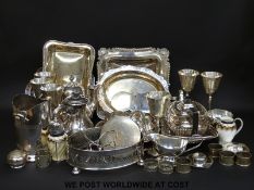 A quantity of plated ware including a George Jones jug and sugar shaker, trays, baskets, nut dish,