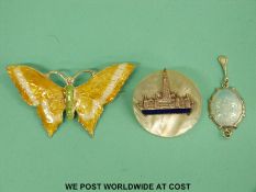 A silver butterfly brooch set with enamel,