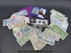 A quantity of coins, uncirculated UK packs, crowns etc,