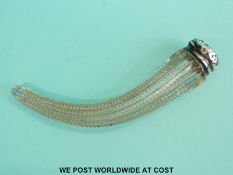 A white metal lidded scent bottle in the form of a horn shaped mull, the lid stamped sterling,