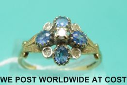 A 9ct gold ring set with diamonds and sapphires in a cluster (size T)