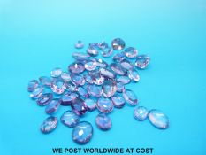 A packet of loose amethysts mainly oval cut