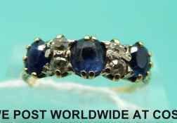 An 18ct gold ring set with diamonds and sapphires (size N)
