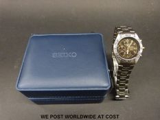 Seiko chronograph titanium gentleman's wristwatch with black dial, three sub-dials, date aperture,
