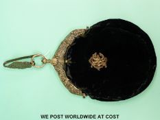 A Dutch white metal mounted velvet bag on hanger, with embossed figural decoration,
